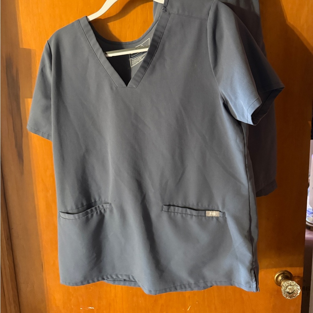 Fig Casma three pocket scrub top and kade cargo pants in space navy.